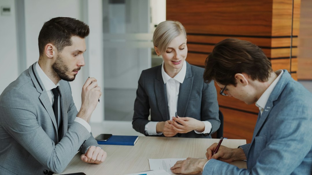 Business professionals discussing documents in an office